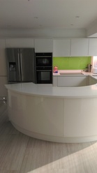 White High gloss curved kitchen